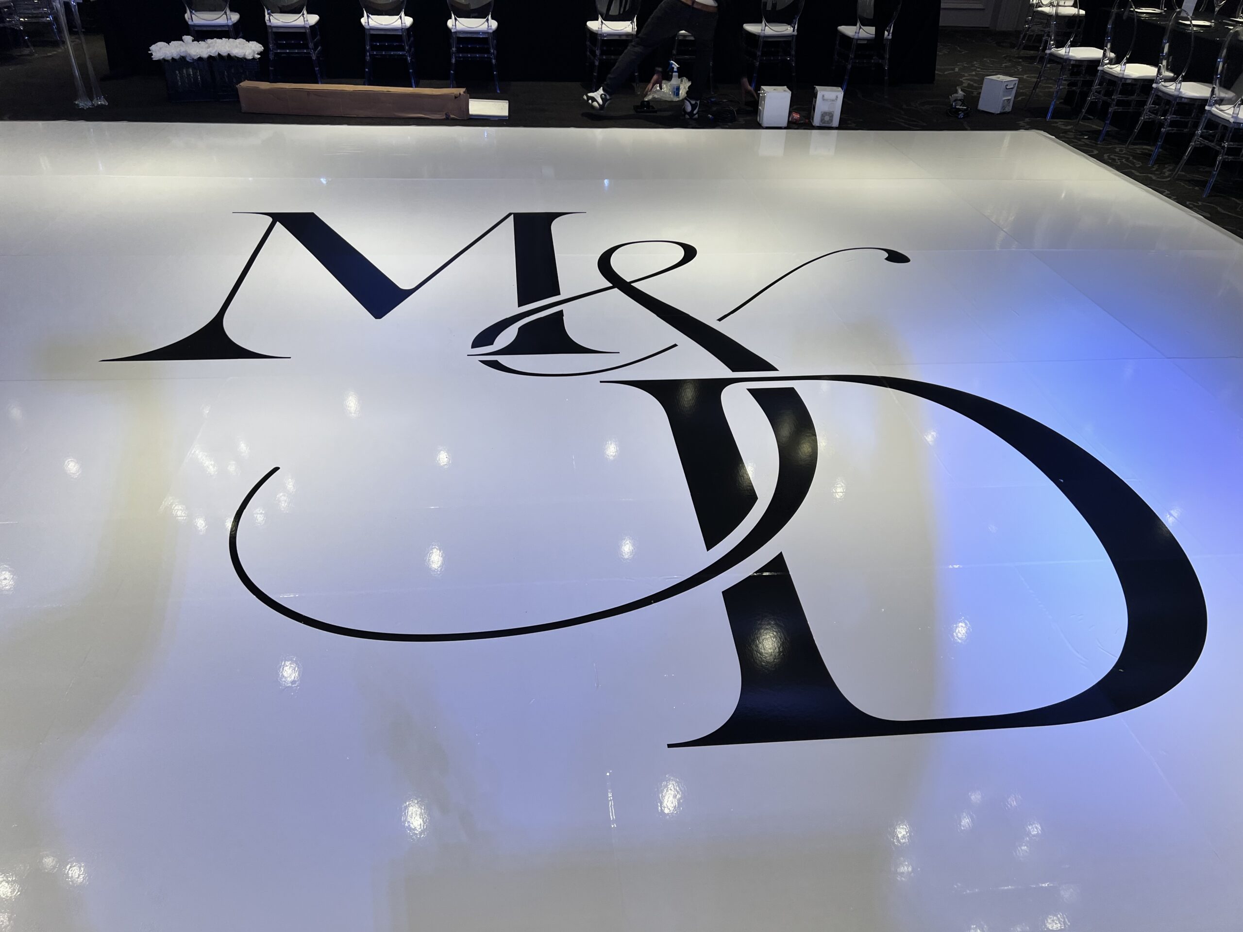 White Monogram Floor wrap A White Monogram Floor Wrap at Wedding Reception